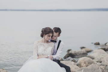 happy tender couple in love on the background of the sea