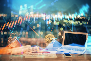 Financial graph colorful drawing and table with computer on background. Double exposure. Concept of international markets.