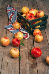 Pile of ripe  pomegranate on wooden backgfround