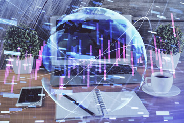 Multi exposure of graph and financial info and work space with computer background. Concept of international online trading.