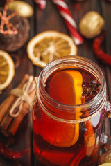 Christmas composition with Glass of glint wine on wooden table close up