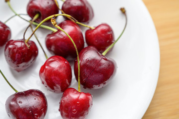Cherry on the table in a cup. Selective focus.