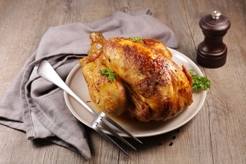 baked chicken, baked poultry on wood background