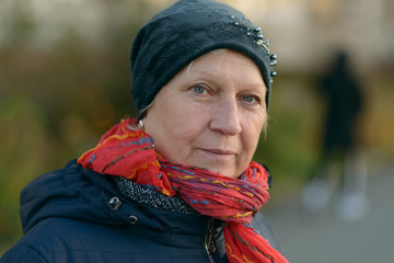 Portrait of a beautiful middle-aged woman in autumn jacket.