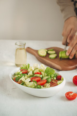 Healthy food and diet menu. Various fresh mix salad with tomato, cucumber, onion
