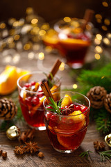 Christmas mulled wine. Traditional festive drink with decorations and fir tree.