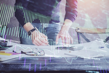 Multi exposure of man standing and planing investment with stock market forex chart.