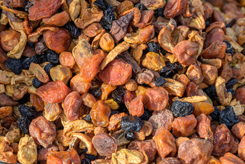 Natural-looking fruits in a street market - dried fruits.