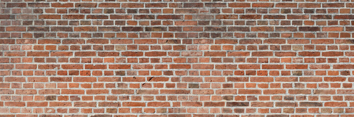 Brick Wall of Red Color, Wide Panorama of Old Wall. Grunge brick.
