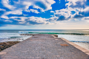 Fototapeta na wymiar Sea pier landscape with blue sea and clouds