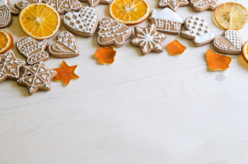 Christmas gingerbread of different kinds on a black and white wooden background