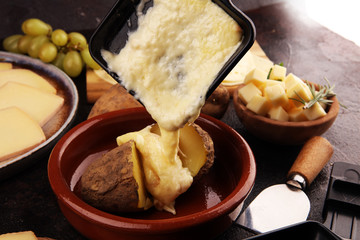 raclette cheese melted served in individual raclette skillets