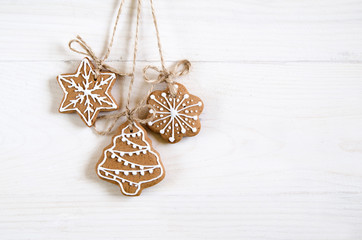 Christmas gingerbread of different kinds on a black and white wooden background