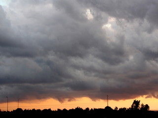 Rain clouds and sunset in rainy weather