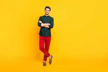 Fototapeta na wymiar Full size photo of charming attractive imposing guy feel he real professional entrepreneur rich wealth millionaire feel satisfied wear modern youth clothing sneakers isolated yellow color background