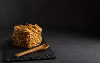 Homemade coffee cake with butter cream and nuts