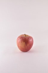Apples and bananas on white background