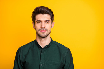 Obraz premium Portrait of serious focused man freelancer look ready solve job problems in his company wear casual style clothing isolated over yellow color background