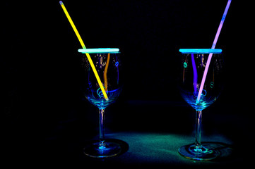 Colourful party in a tropical bar wine glass light reflection with dark background for holidays, christmas, new year and gathering leisure