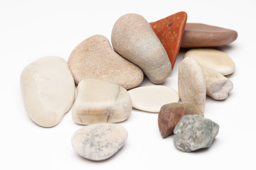 Fototapeta na wymiar Bunch smooth stones white background