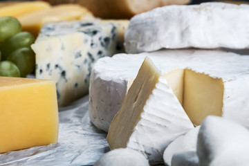 assorted cheeses, soft, hard, rennet and brine with fruits, nuts and dried fruits