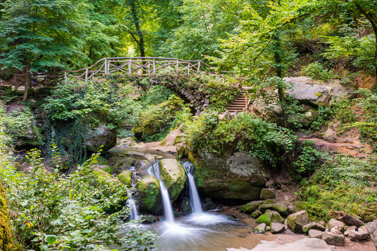 The Schiessent&uuml;mpel in M&uuml;llerthal / Luxembourg - waterfall, romantic bridge and nature atmosphere