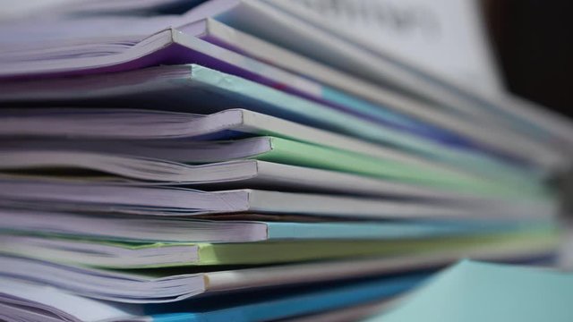 stacks of document book or paperwork on table about accounting planning budget in offices, arranging documents of financial folder at business workplace