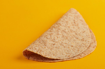 One empty folded tortilla