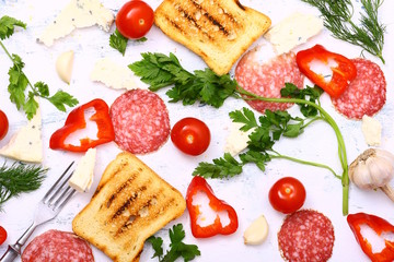 tasty crispy toast and vegetables on white