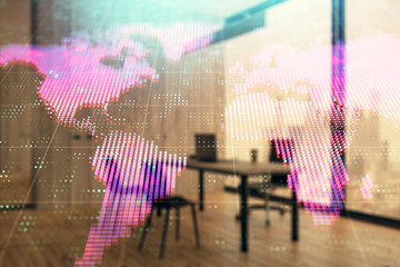 Obraz premium World map hologram and minimalistic cabinet interior background. Double exposure. International business concept.