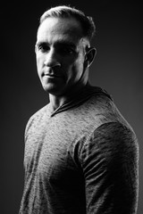 Studio shot of muscular man in black and white