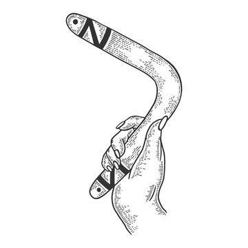 recommend clip art: Boomerang weapon in hand sketch engraving vector illustration. Scratch board style imitation. Black and white hand drawn image.