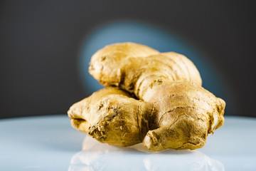 Closeup of fresh root ginger on plate