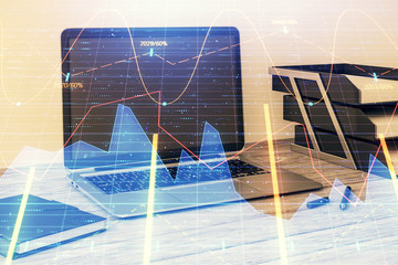 Stock market chart and desktop office computer background. Multi exposure. Concept of financial...
