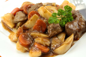 plate of beef bourguignon and potato