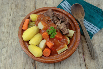dish of pot au feu with beef on a table