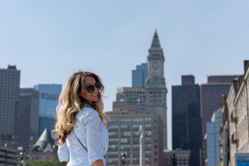 Fototapeta na wymiar Blonde woman in blue shirt posing in Boston