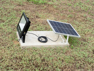 Solar panel for open spotlight on the field in the park.Solar cells help protect  the environment and energy saving.