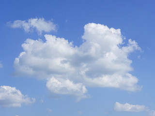 Naklejka na ściany i meble Big cloud floating in the sky shaped like a plane.