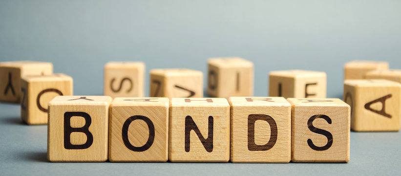 Wooden blocks with the word Bonds. A bond is a security that indicates that the investor has provided a loan to the issuer. Equivalent loan. Unsecured, secured bonds. Business and finance