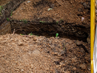 trench for cable laying in summer, Moscow.