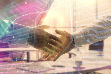 Double exposure of blockchain theme drawing on office background with two businessmen handshake. Concept of crypto economy