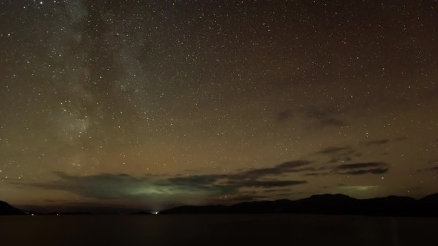 time lapse footage of the milky way galaxy high above loch linnhe a sea loch in the argyll region of the highlands of scotland near fort william and duror in autumn