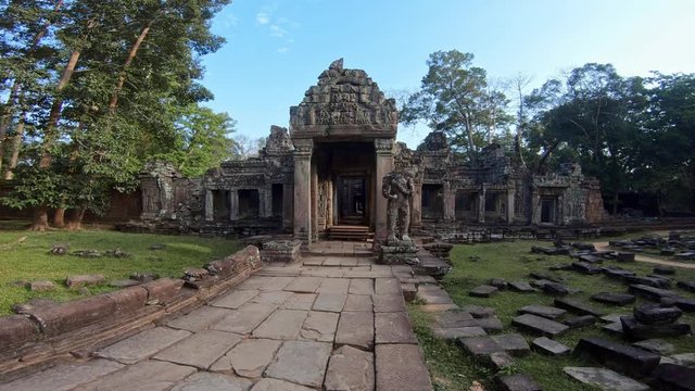 4K, Entrance door to Preah Khan temple. Gate with one guard sculpture. Ancient monument ruins in Angkor Thom Cambodia. Religious architecture landmarks buildings near Siem Reap. Khmer empire. -Dan