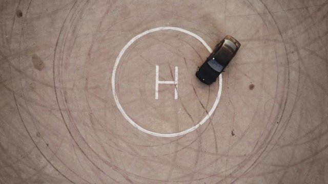 Ariel Overhead Shot Drift Sports Car In A Circle