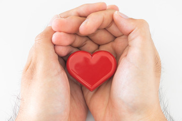 Fototapeta premium ハートを持つ男性の手