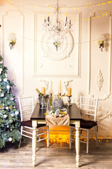 A decorated christmas dining table with champagne glasses