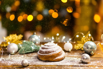 Fototapeta na wymiar Homemade traditional winter festive Bun on wooden background.