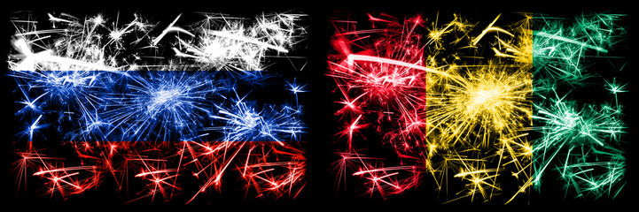 Russia, Russian vs Guinea, Guinean New Year celebration sparkling fireworks flags concept background. Combination of two states flags