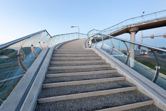 Glass pedestrian bridge Barendrecht Netherlands. Stairs.